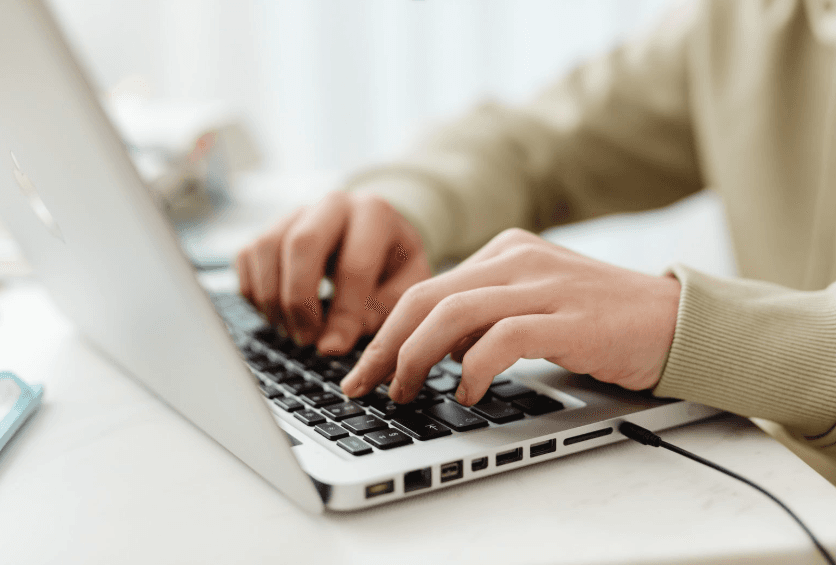 A TPA team member processing claims at a laptop